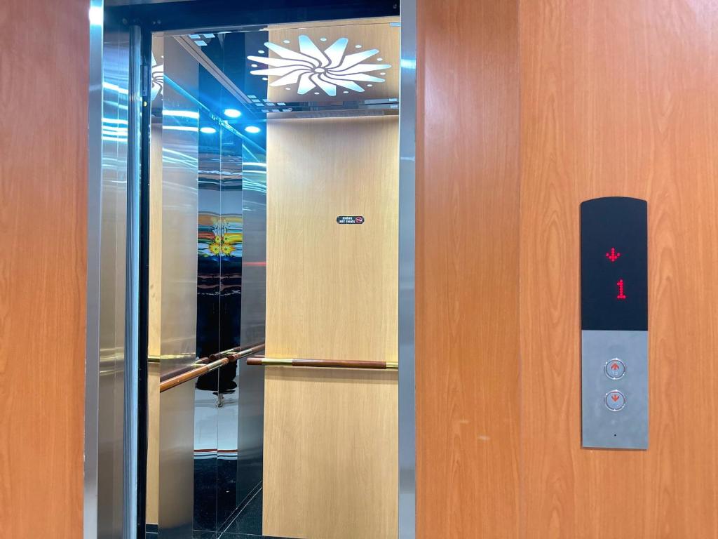 a elevator with a door with a sign on it at Milan Homestay - Milanesa Hotel and Apartment in Vung Tau