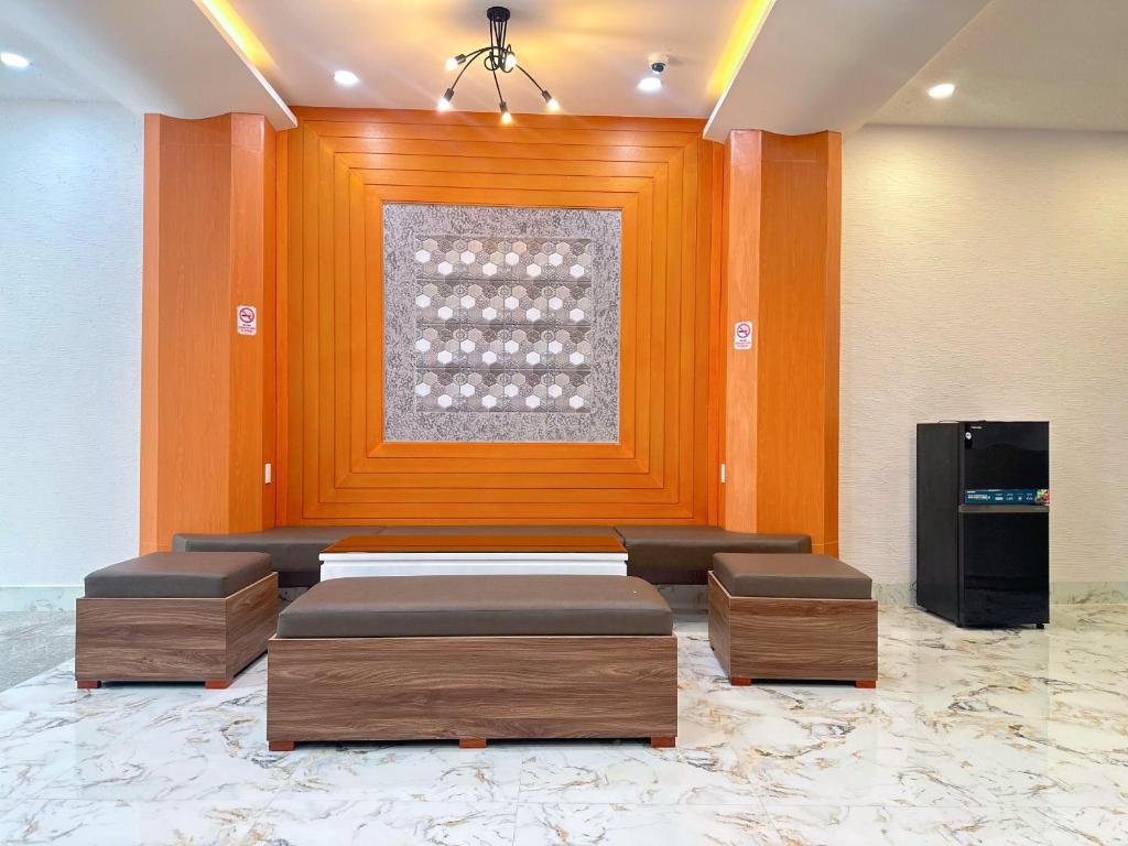 a room with two beds and a window in it at Milan Homestay - Milanesa Hotel and Apartment in Vung Tau