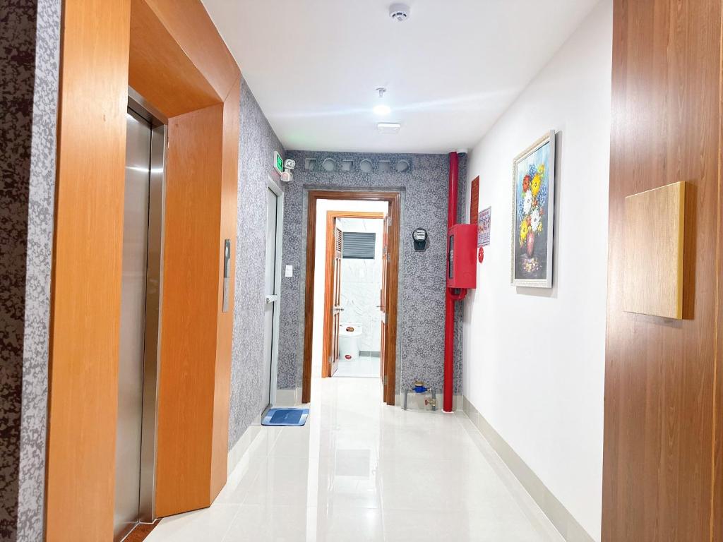 a corridor of a room with a hallway at Milan Homestay - Milanesa Hotel and Apartment in Vung Tau