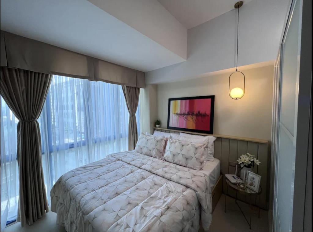 Postel nebo postele na pokoji v ubytování 38 Park Avenue Condominium Cebu IT Park - Unit Freyja