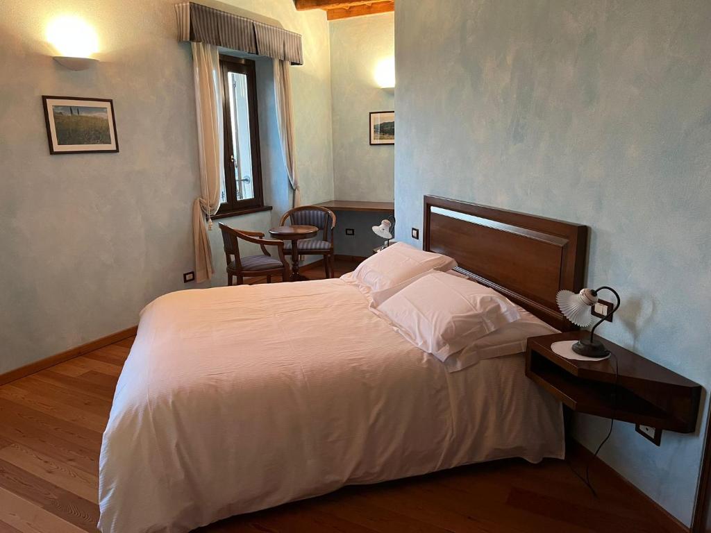 Postel nebo postele na pokoji v ubytování 039 Maggioni B&B