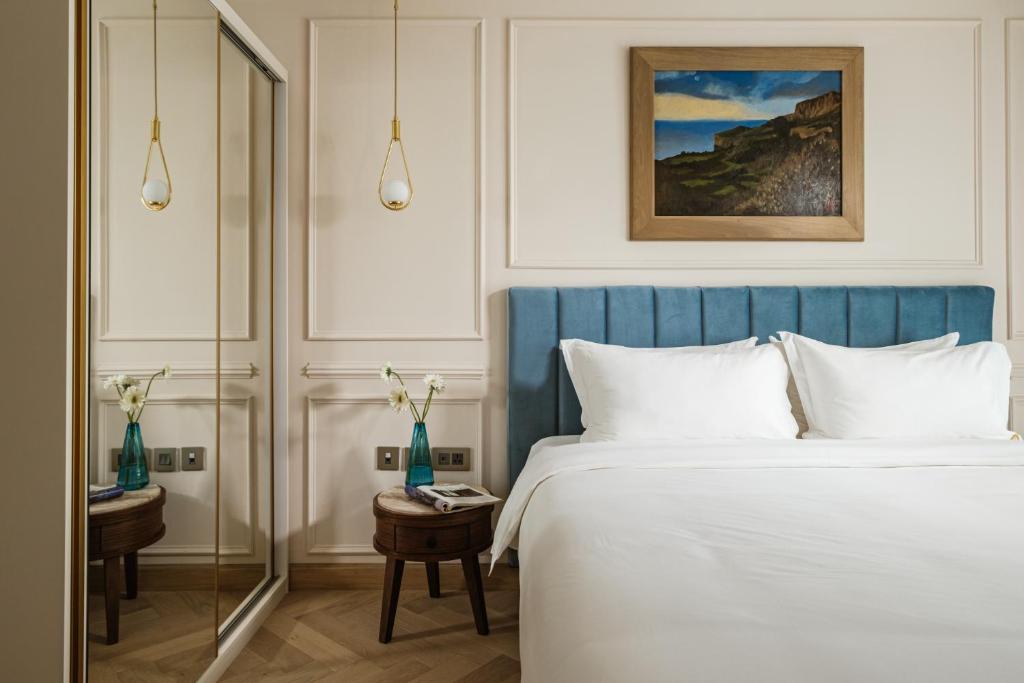 Postel nebo postele na pokoji v ubytování Palazzo Castagna Boutique Hotel