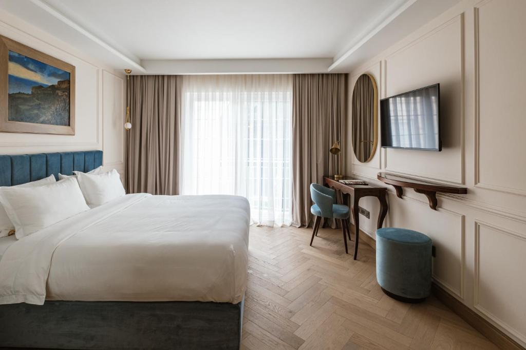 Postel nebo postele na pokoji v ubytování Palazzo Castagna Boutique Hotel