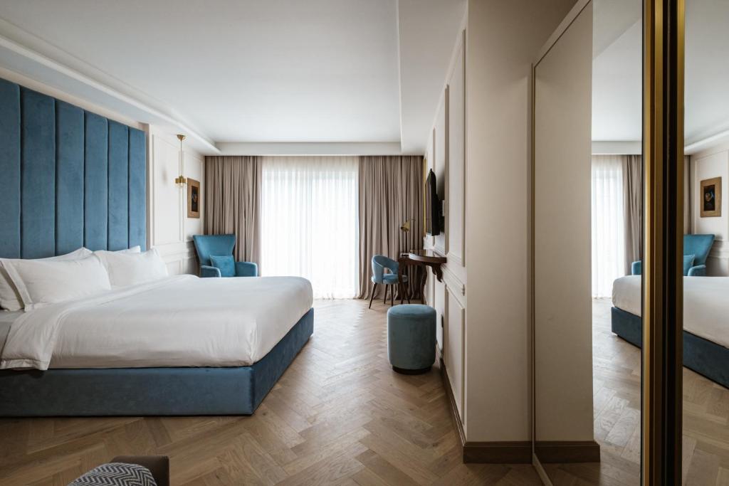 Postel nebo postele na pokoji v ubytování Palazzo Castagna Boutique Hotel