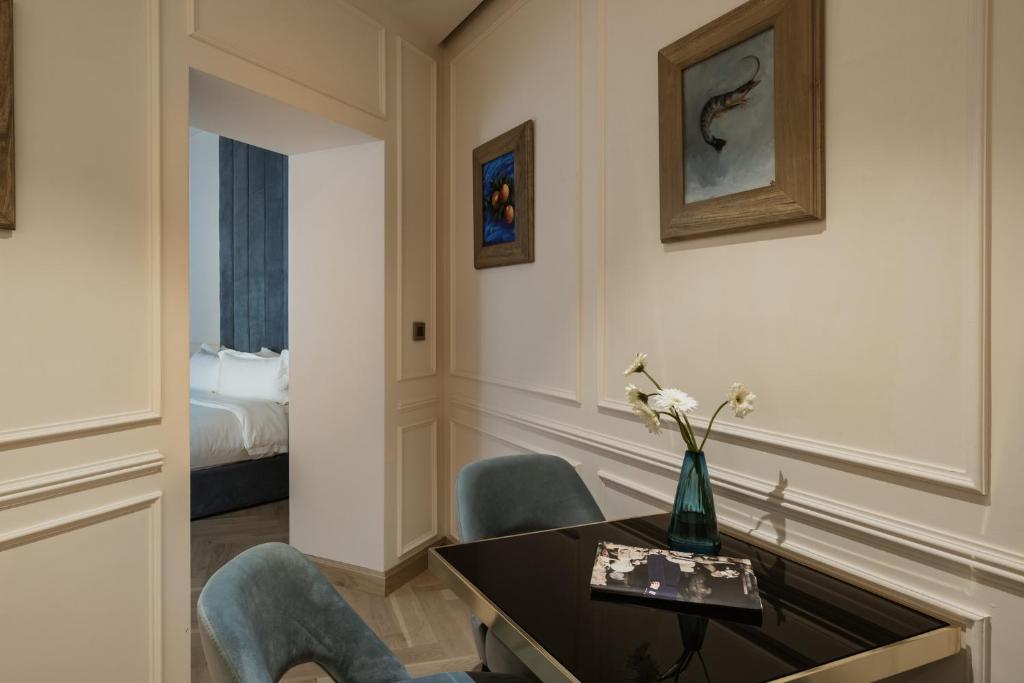 Postel nebo postele na pokoji v ubytování Palazzo Castagna Boutique Hotel