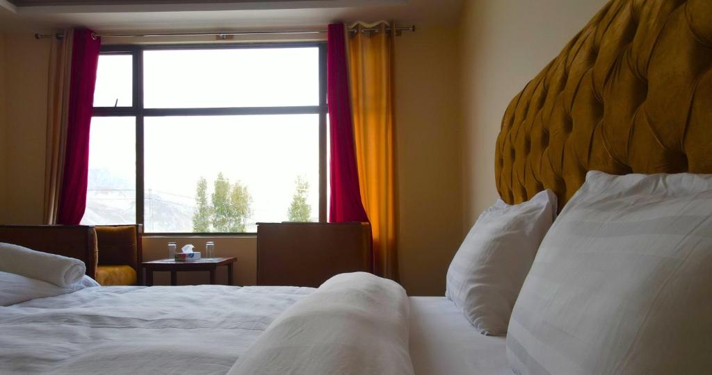 Postel nebo postele na pokoji v ubytování Apex Hotels and Resorts Hussaini