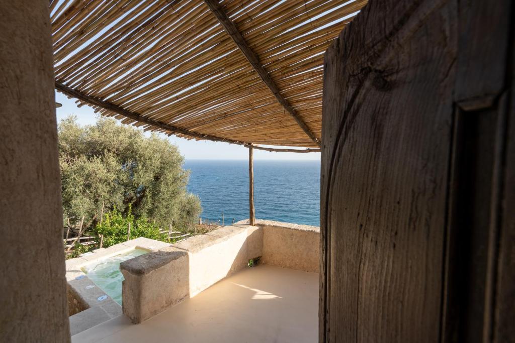 a view of the ocean from a house with a view at Aurora apartment in Alma Domus in Amalfi