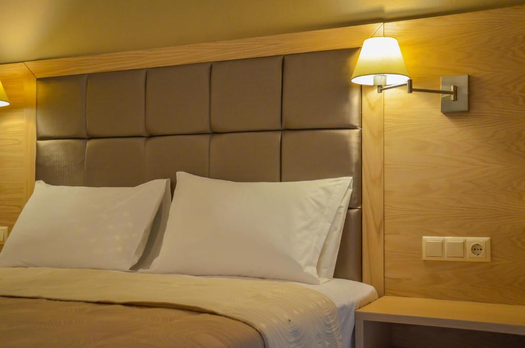 Postel nebo postele na pokoji v ubytování Agali Rooms