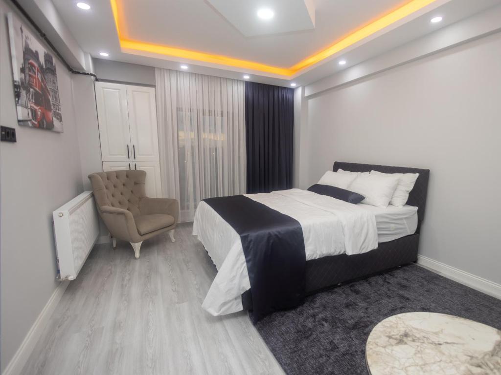 En eller flere senge i et værelse på PAMELA SUİT APART
