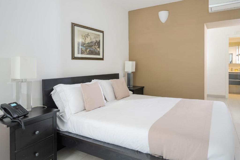 Posteľ alebo postele v izbe v ubytovaní Residence Le Axidie