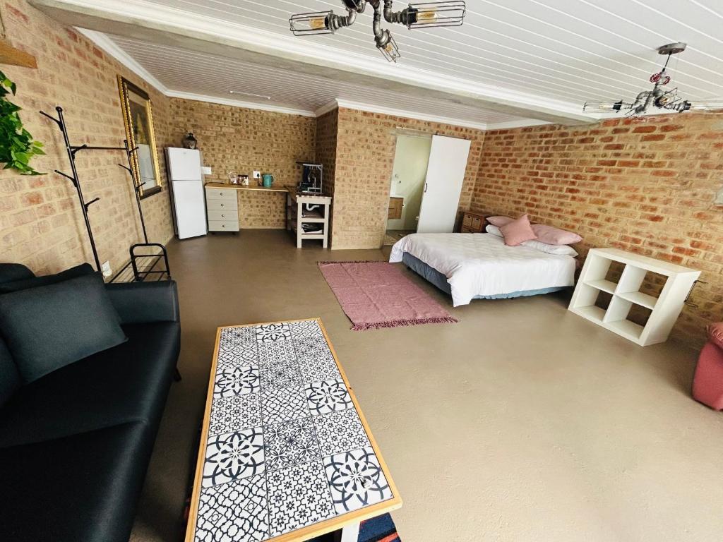 Ένα ή περισσότερα κρεβάτια σε δωμάτιο στο Agulhas House