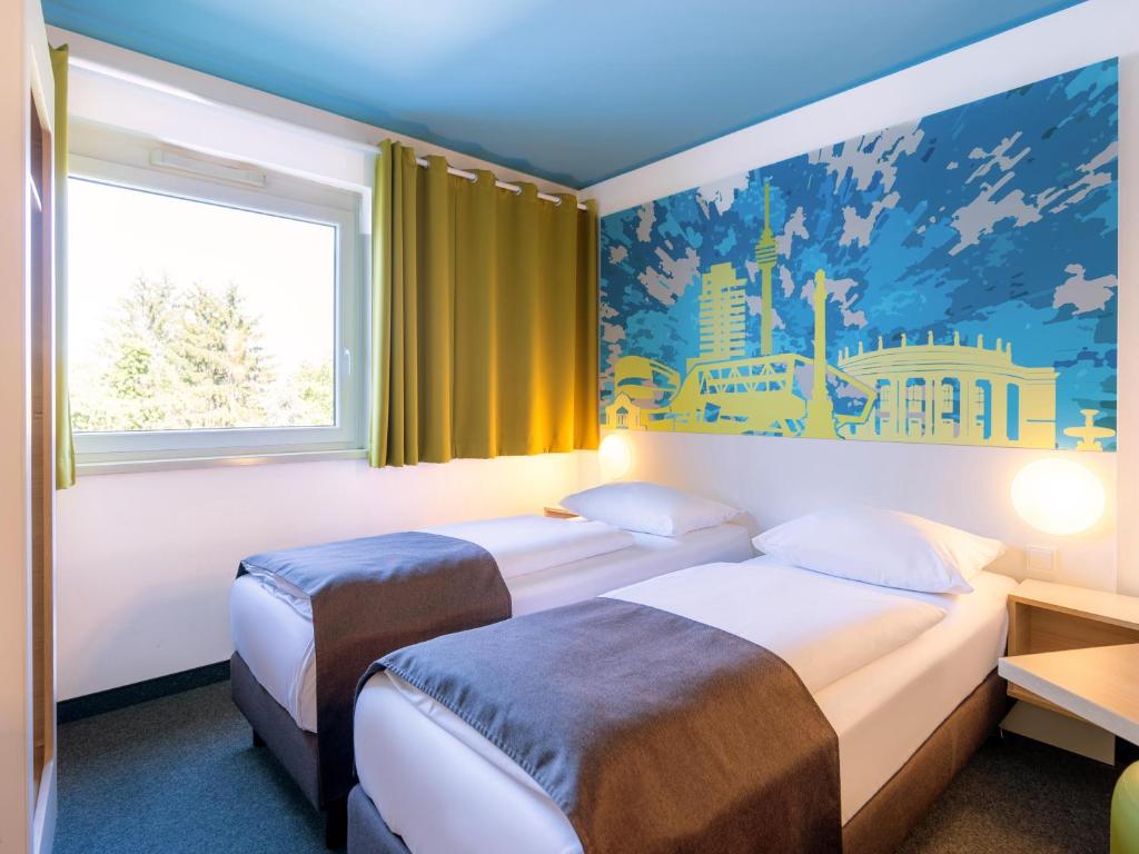 Letto o letti in una camera di B&B Hotel Stuttgart-City