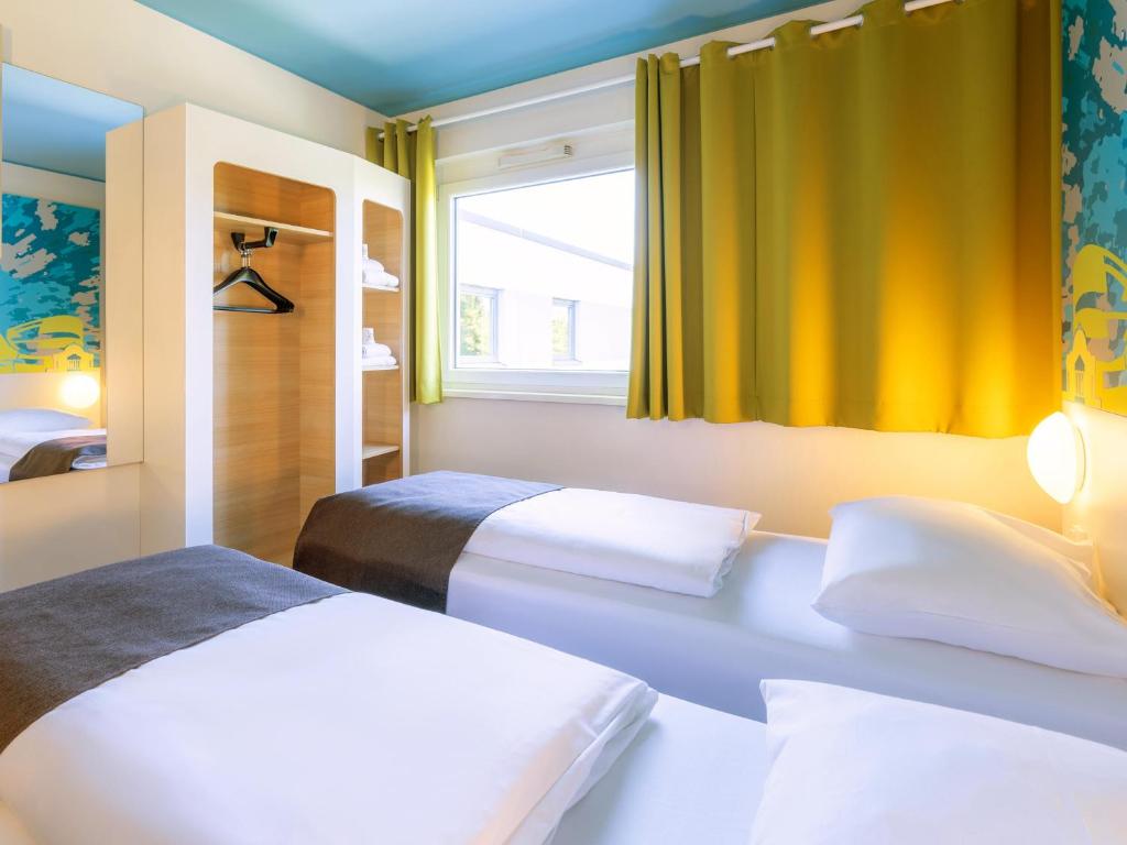 Letto o letti in una camera di B&B Hotel Stuttgart-City