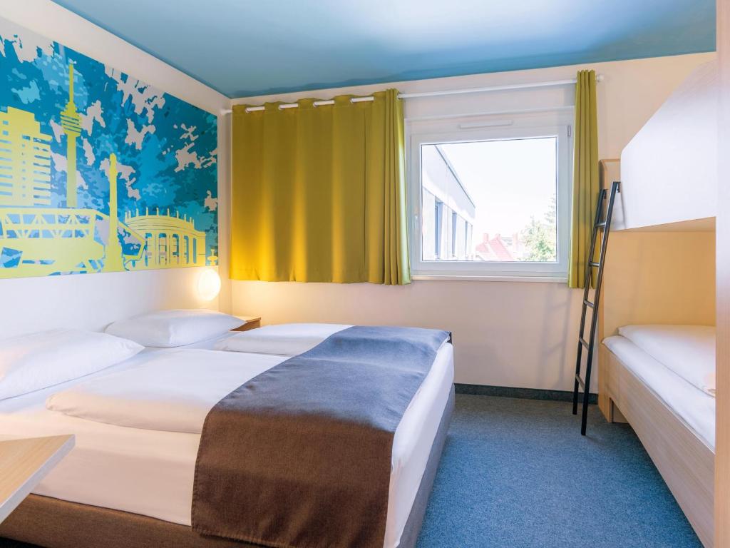 Letto o letti in una camera di B&B Hotel Stuttgart-City