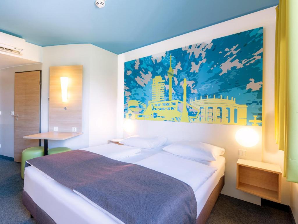 Letto o letti in una camera di B&B Hotel Stuttgart-City