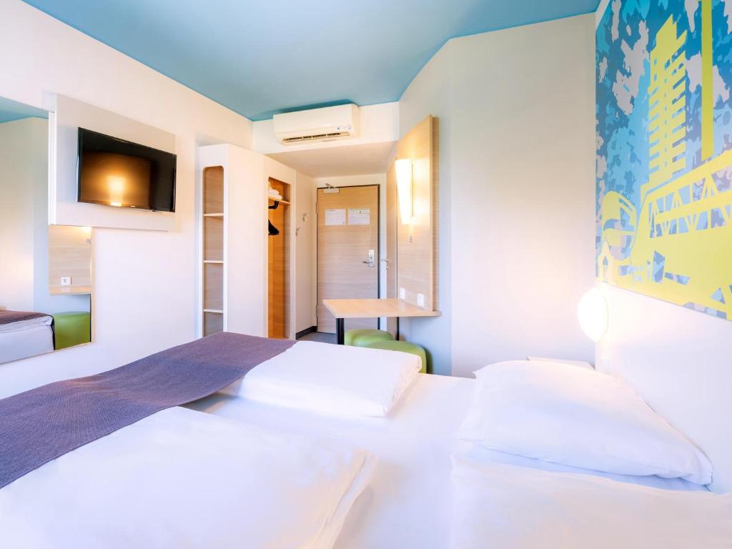 Letto o letti in una camera di B&B Hotel Stuttgart-City