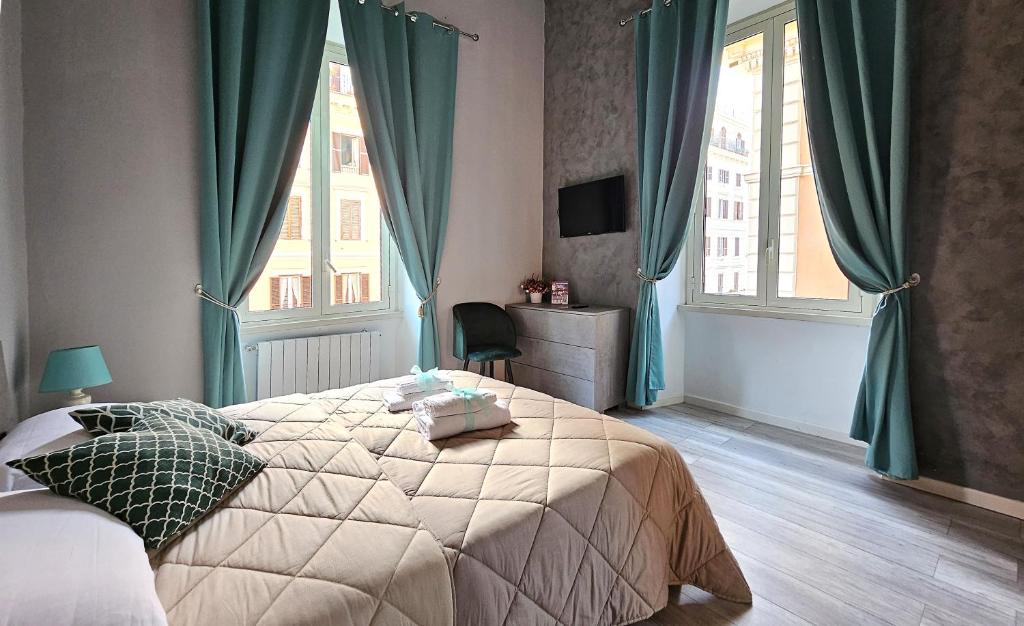 a bedroom with a bed and a large window at GIRASOLE SUITES in Rome
