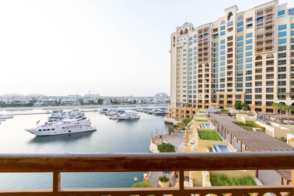 a view of a marina with boats in the water at SEA and ATLANTIS VIEW COZY 3BR RESORT PALM JUMEIRAH in Dubai