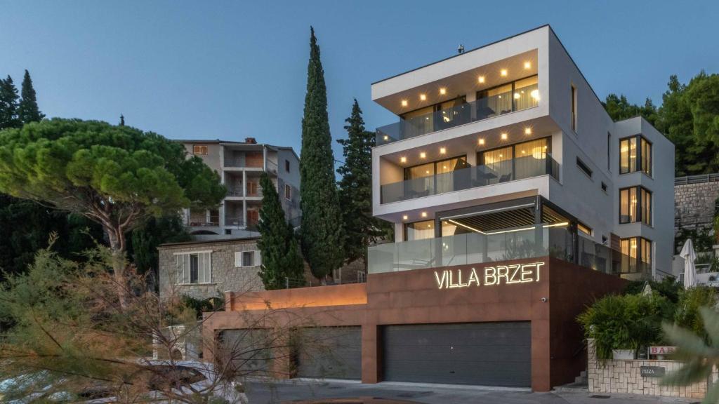 a building with a sign that reads villa aggregate at Villa Brzet - Luxury Boutique Apartments in Omiš