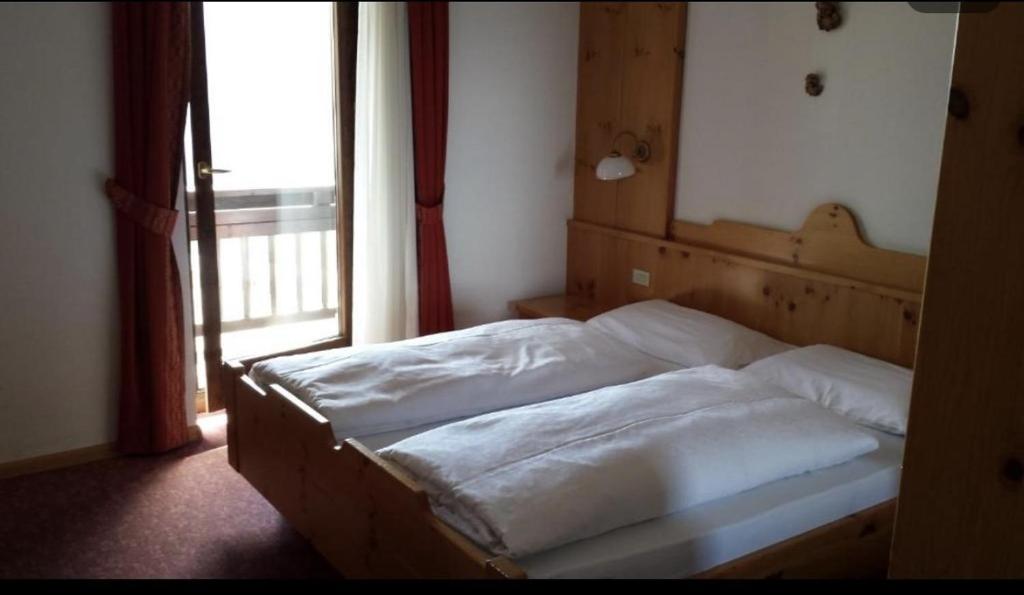 Postel nebo postele na pokoji v ubytování Hotel Savoia