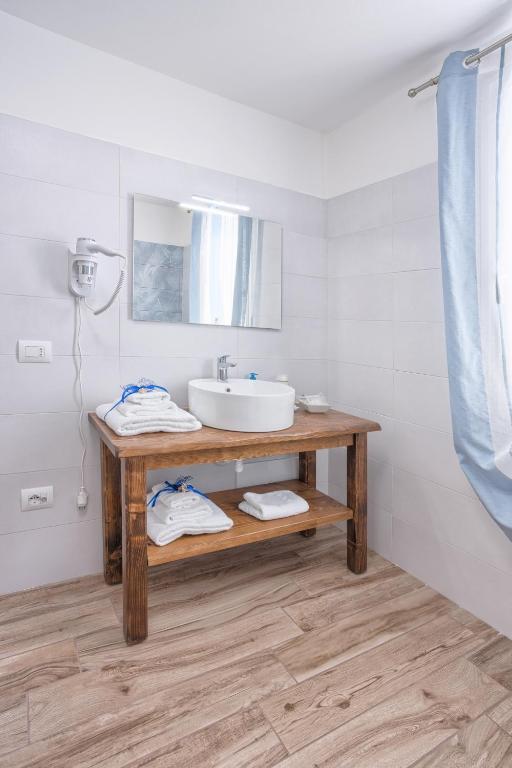 Postel nebo postele na pokoji v ubytování LANTERNA DEL DELTA Guest House