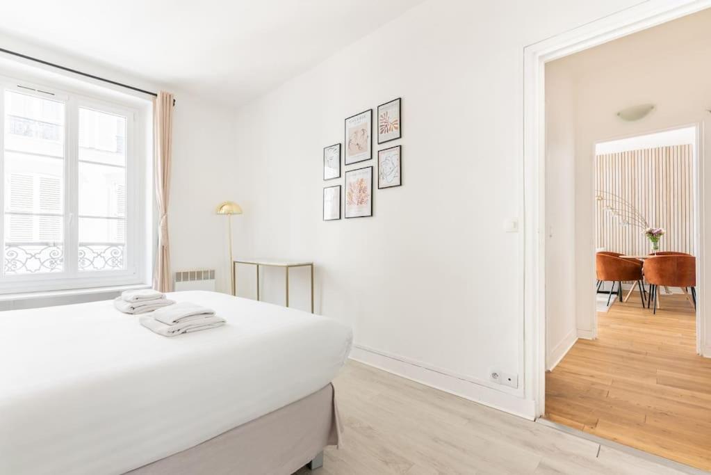 Posteľ alebo postele v izbe v ubytovaní Appartement Champ de Mars - Augereau