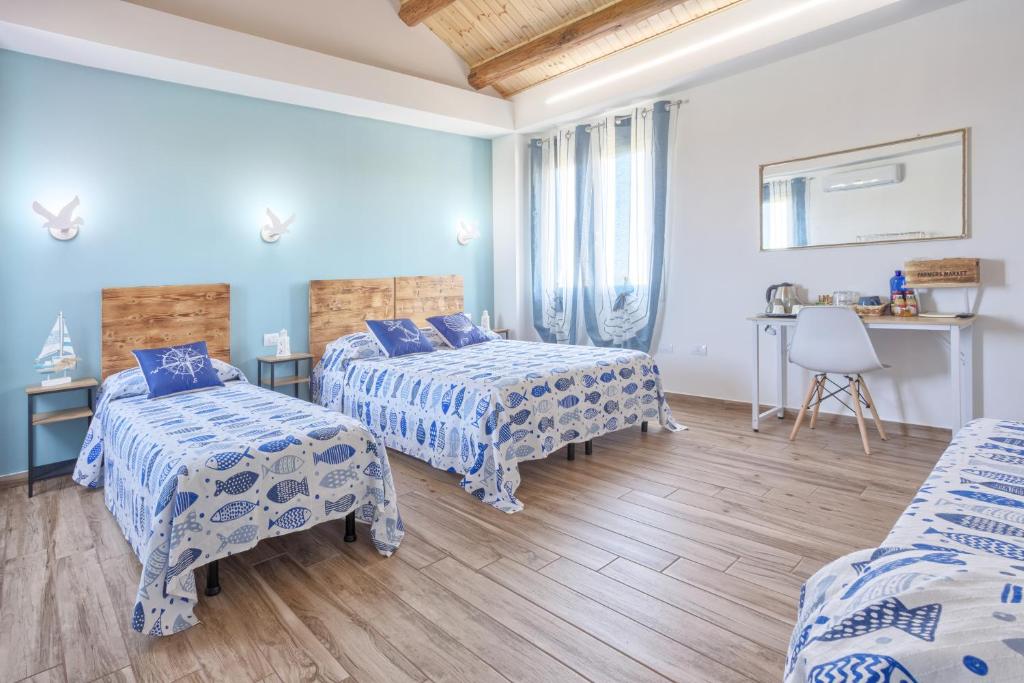 Postel nebo postele na pokoji v ubytování LANTERNA DEL DELTA Guest House