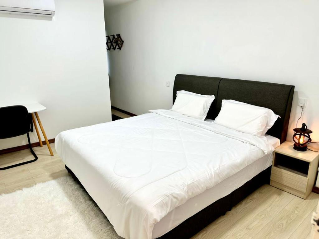 Postel nebo postele na pokoji v ubytování Three Homestay