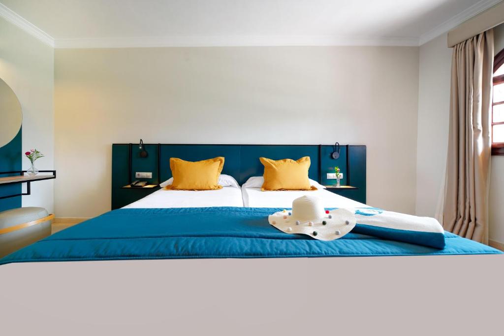 Letto o letti in una camera di Suites & Villas by Dunas