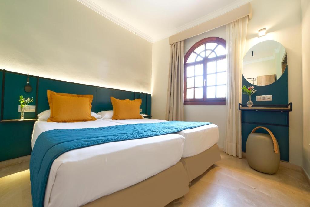 Letto o letti in una camera di Suites & Villas by Dunas