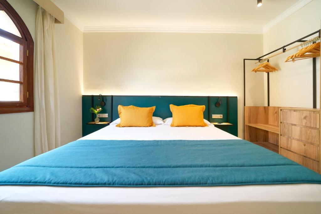 Letto o letti in una camera di Suites & Villas by Dunas