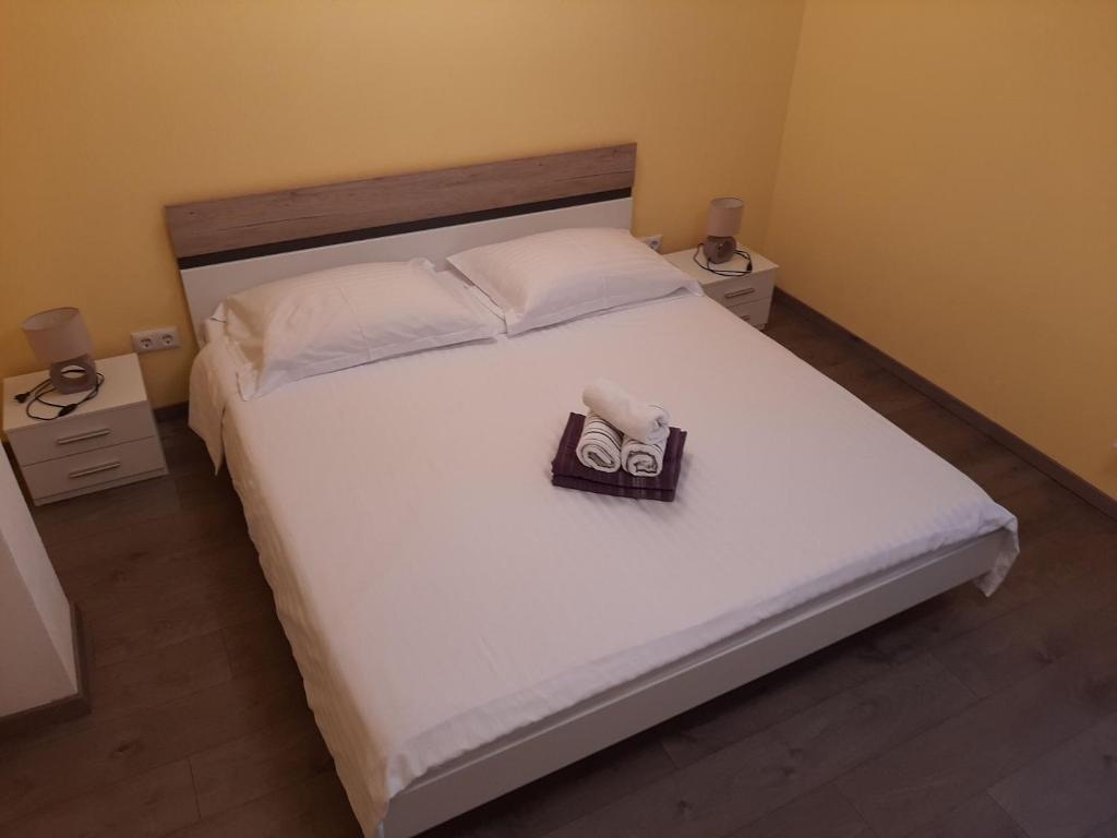 Postel nebo postele na pokoji v ubytování Apartments Pavelic