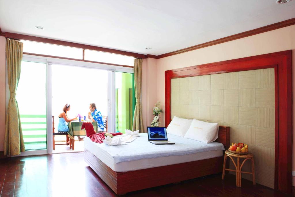 Postel nebo postele na pokoji v ubytování El Nido Beach Hotel