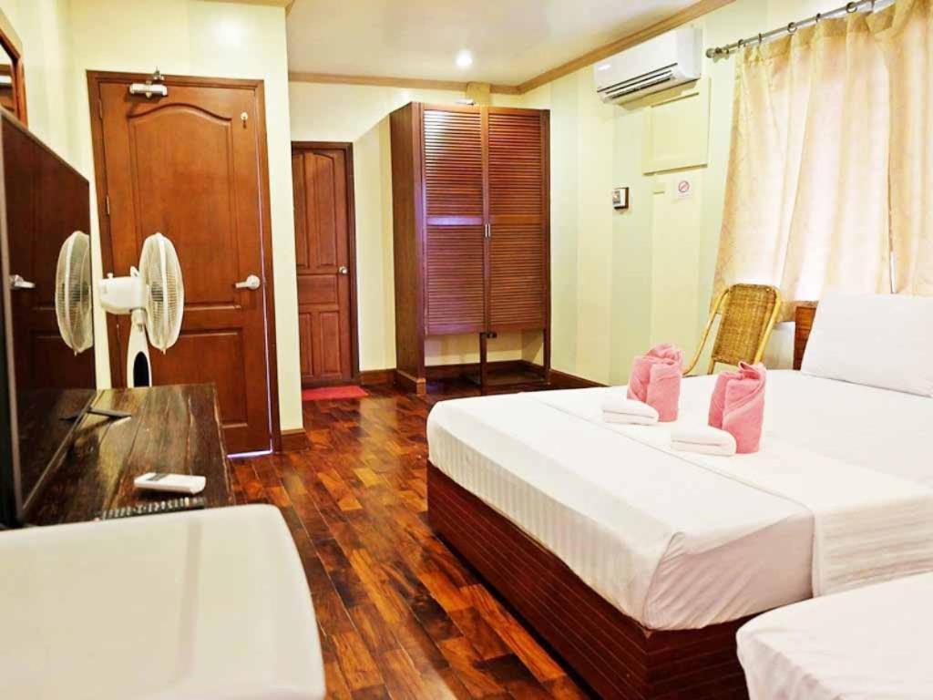 Postel nebo postele na pokoji v ubytování El Nido Beach Hotel