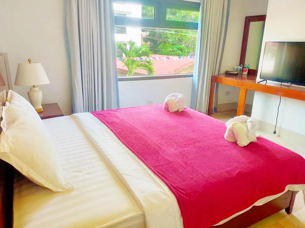 Postel nebo postele na pokoji v ubytování El Nido Beach Hotel