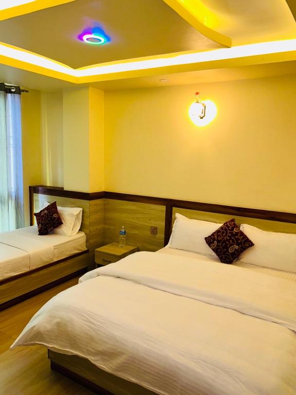 Postel nebo postele na pokoji v ubytování Hotel Balgopal
