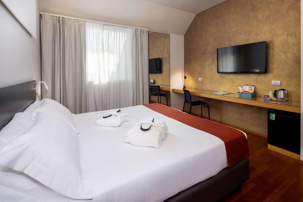 Postel nebo postele na pokoji v ubytování Best Western Hotel Major