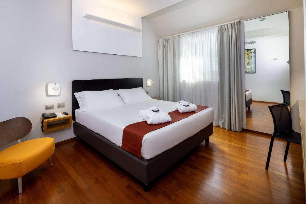 Postel nebo postele na pokoji v ubytování Best Western Hotel Major
