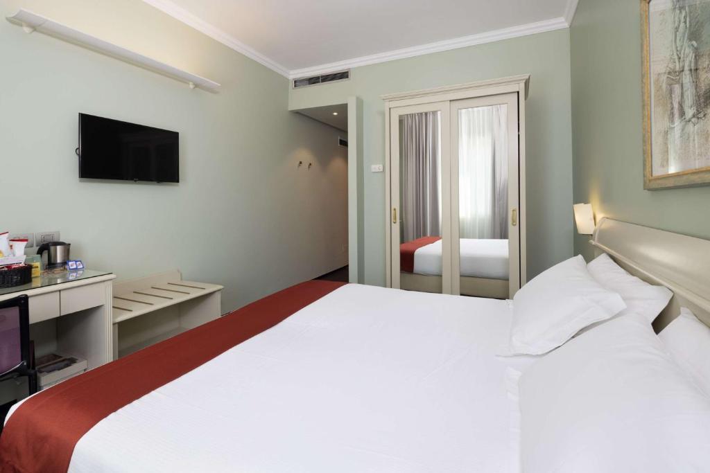 Postel nebo postele na pokoji v ubytování Best Western Hotel Major