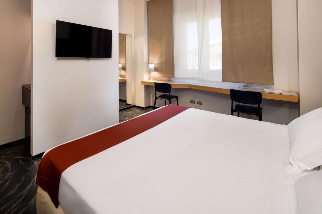 Postel nebo postele na pokoji v ubytování Best Western Hotel Major