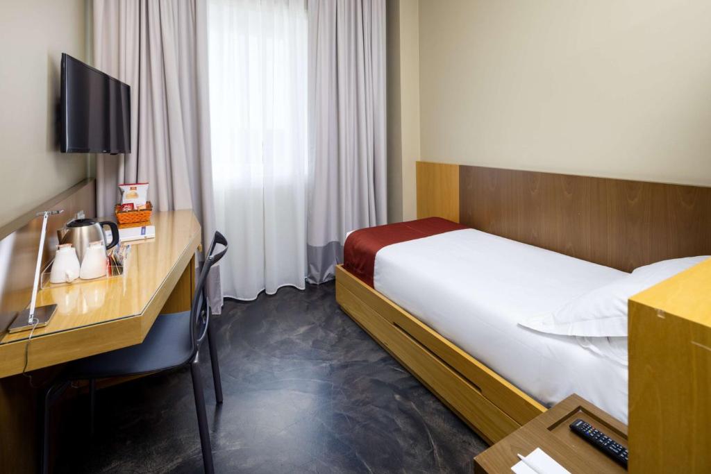 Postel nebo postele na pokoji v ubytování Best Western Hotel Major