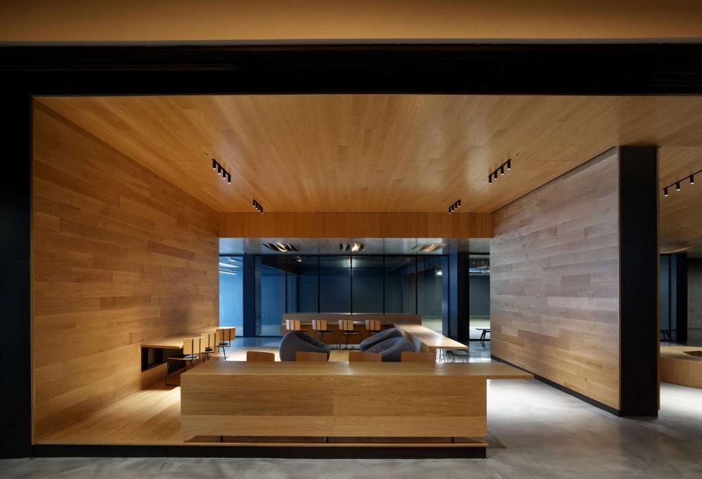 an office with wooden walls and a table and chairs at BEI San Francisco, Trademark Collection by Wyndham in San Francisco