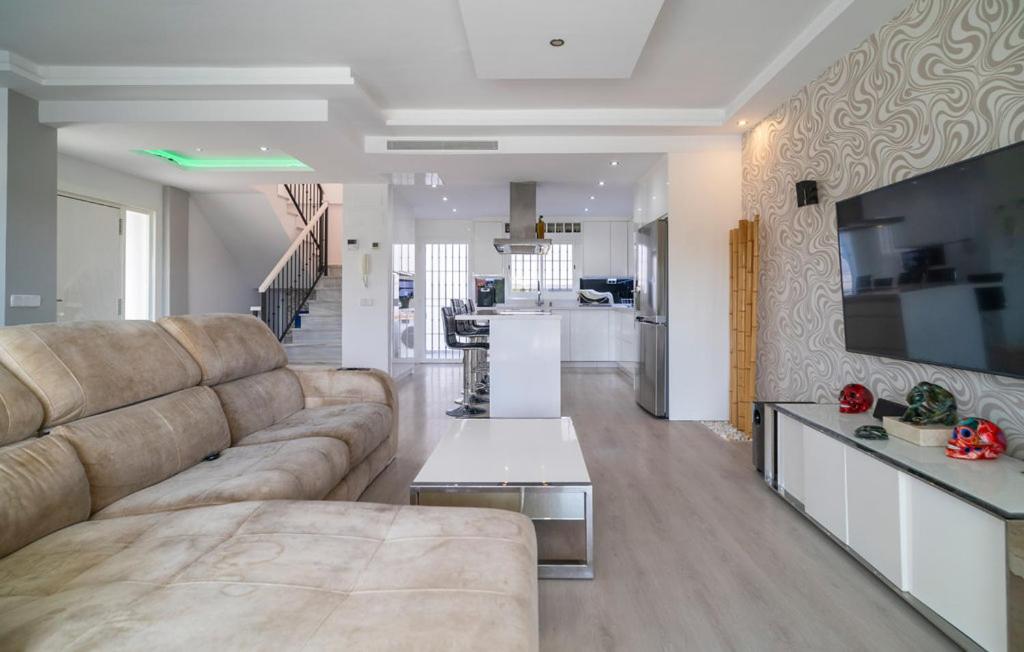 a large living room with a couch and a table at Thelifehouse in Marbella