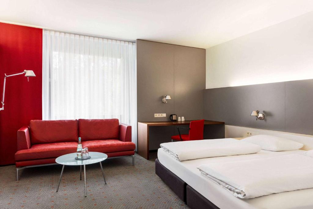 Postel nebo postele na pokoji v ubytování Vienna House Easy by Wyndham Stuttgart