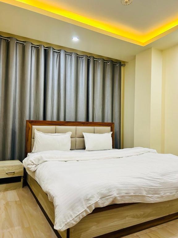 Postel nebo postele na pokoji v ubytování Hotel Balgopal