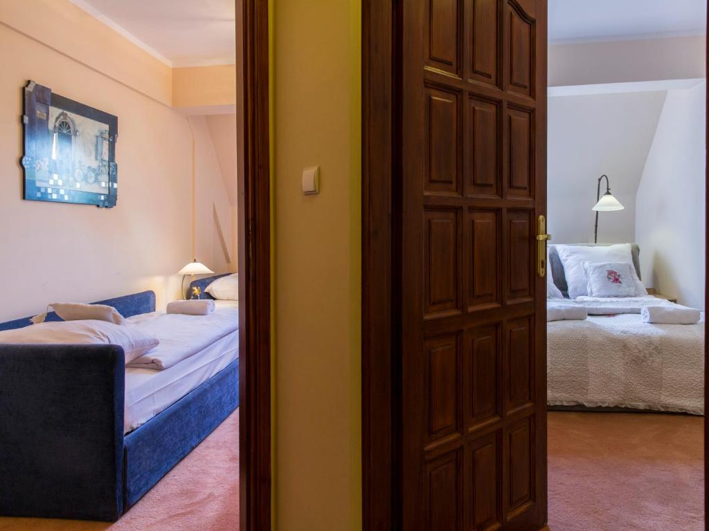 Posteľ alebo postele v izbe v ubytovaní udanypobyt Apartamenty Orkana Park Centrum
