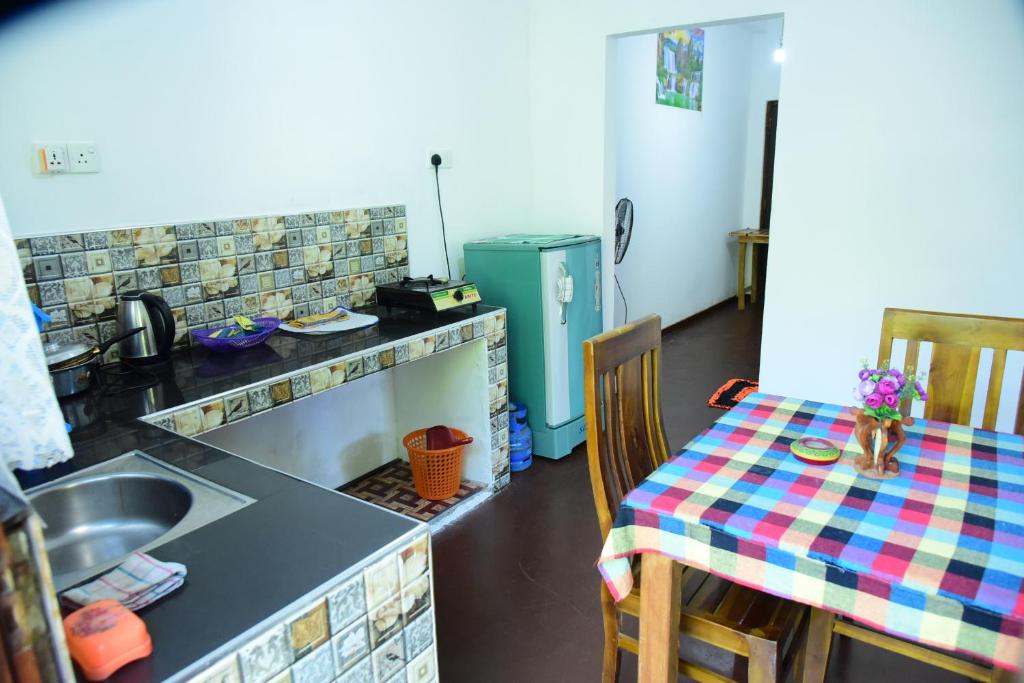 Kuchyň nebo kuchyňský kout v ubytování Sun Ground Villa