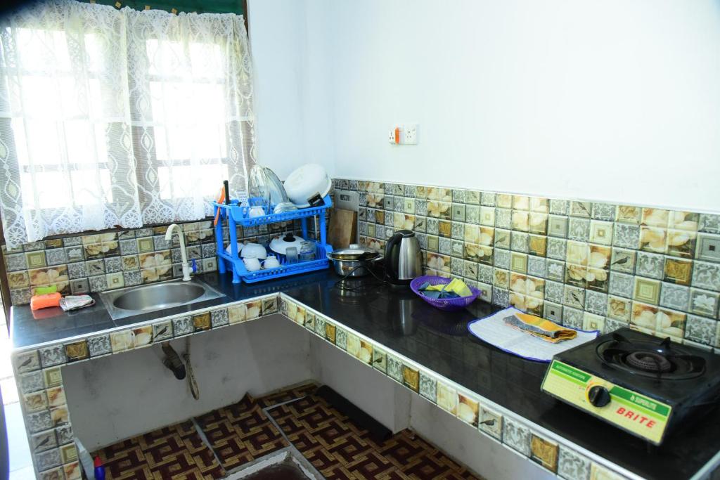 Kuchyň nebo kuchyňský kout v ubytování Sun Ground Villa