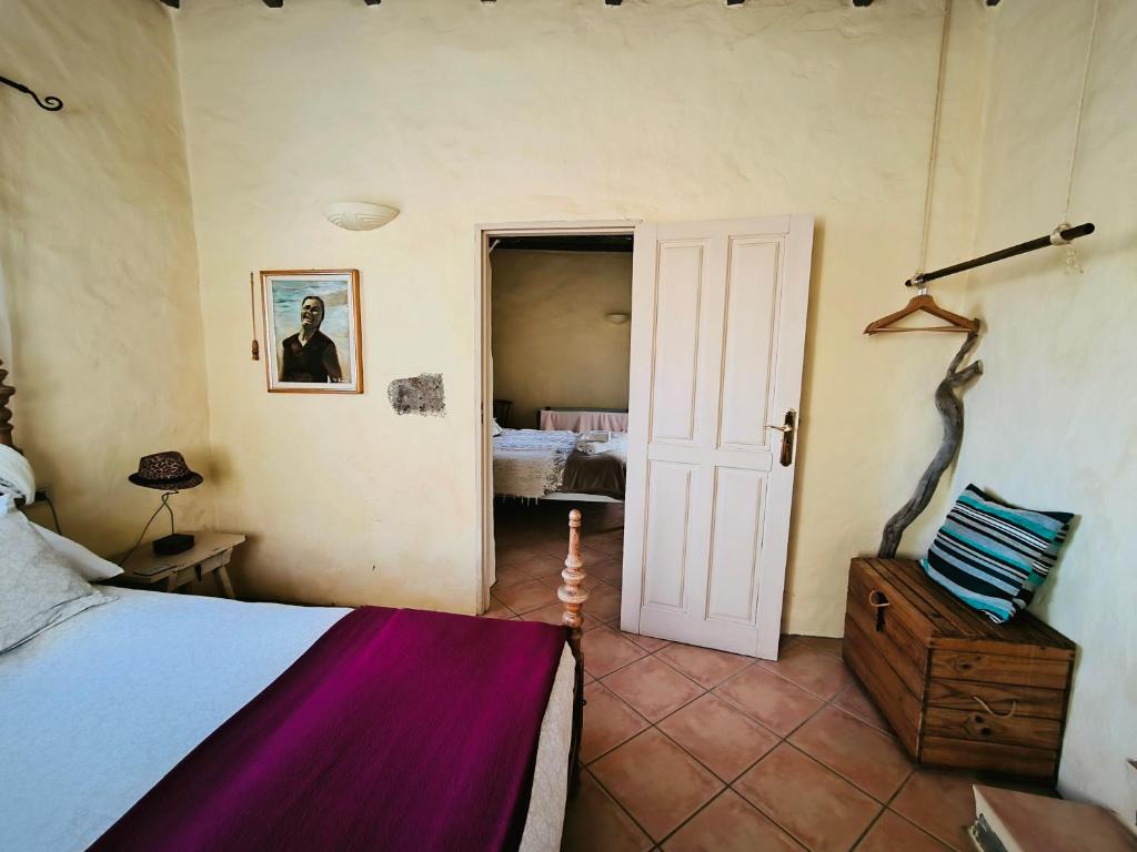 Postel nebo postele na pokoji v ubytování Villa El Perinqué