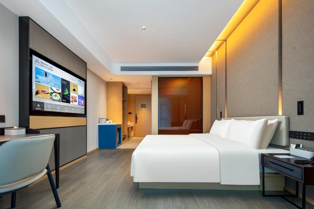 TV a/nebo společenská místnost v ubytování Atour Hotel Meizhou West Station R&F Center